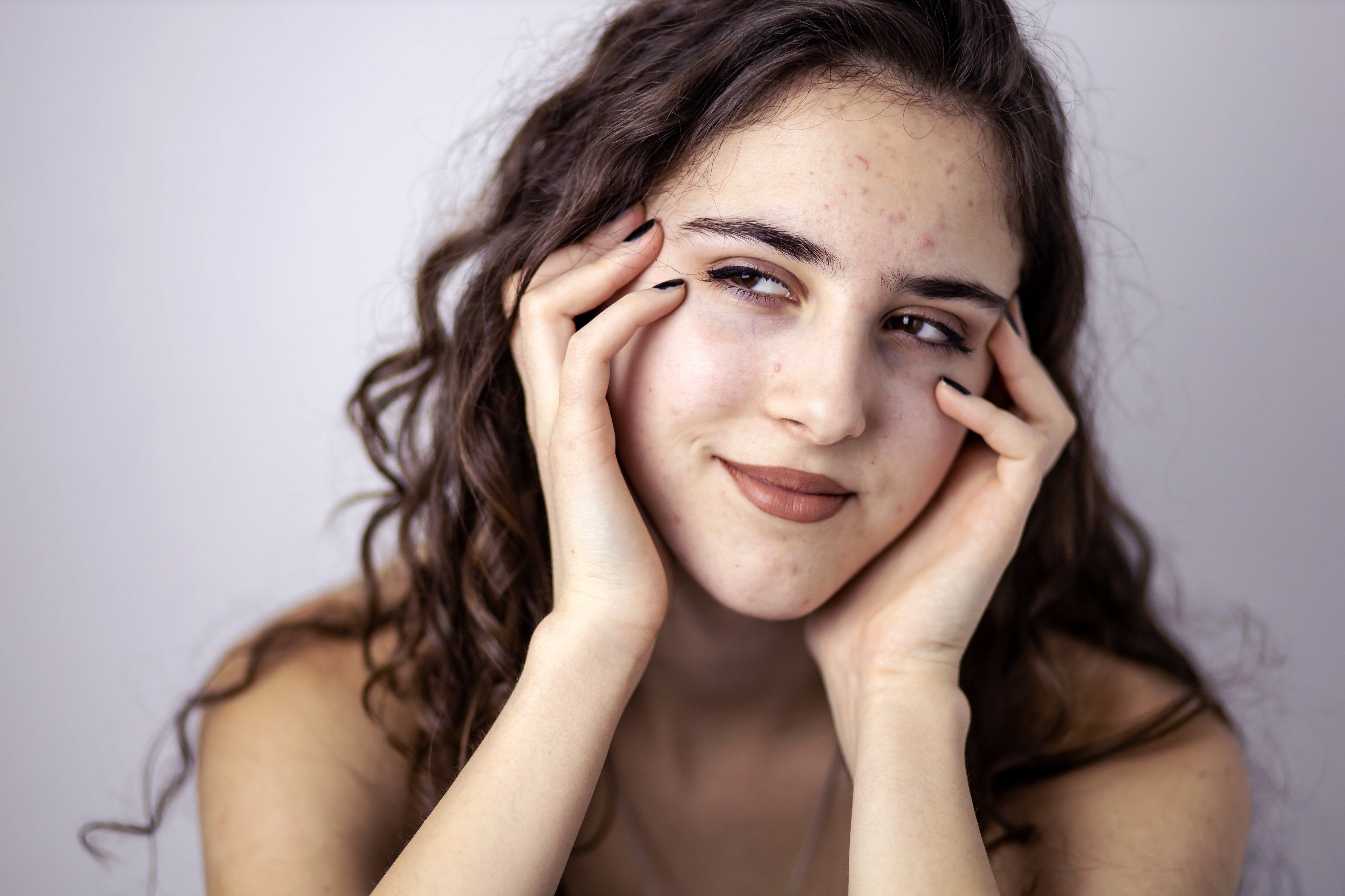 Licensed esthetician performing a gentle facial treatment for a teen client at Boca Skin and Lash in Boca Raton Florida