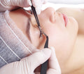 Licensed esthetician applying lash extensions in a clean Boca Raton studio